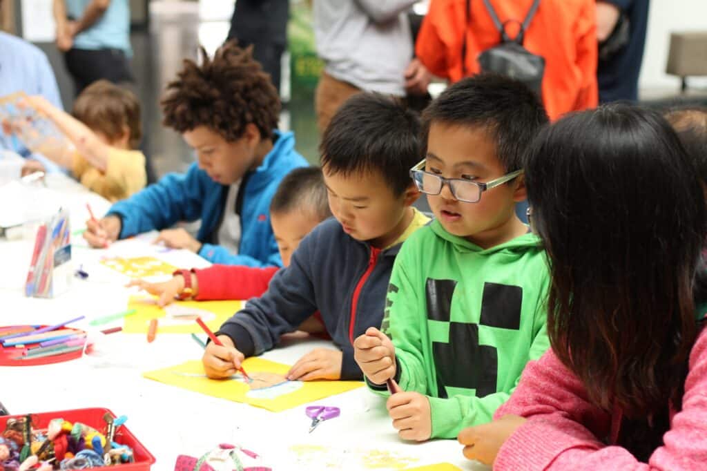 Children drawing at a table